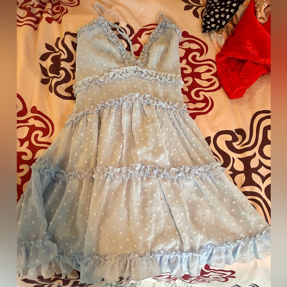 This is a blue flowy mini dress.